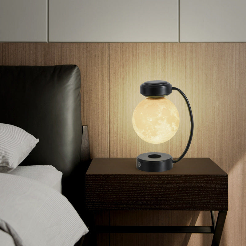 Moon lamp glowing warm on a desk