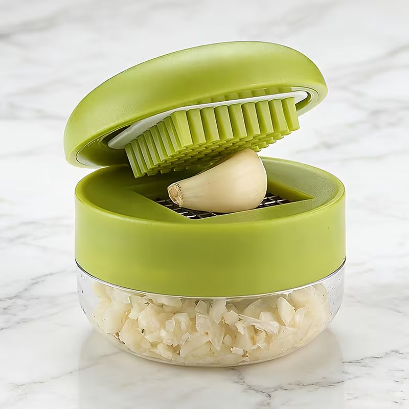 Garlic Mincer Jar in use pressing fresh garlic cloves into mince